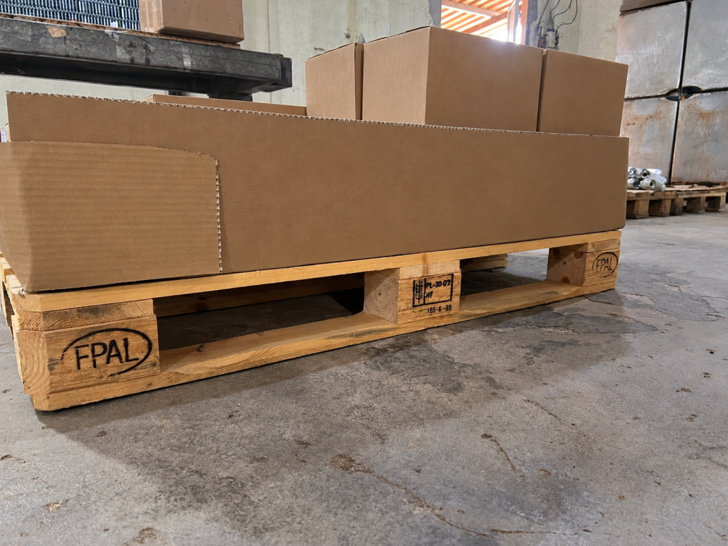 EPAL wooden pallet supporting corrugated cardboard protective packaging and export cartons at Truc Lam, Vietnam.